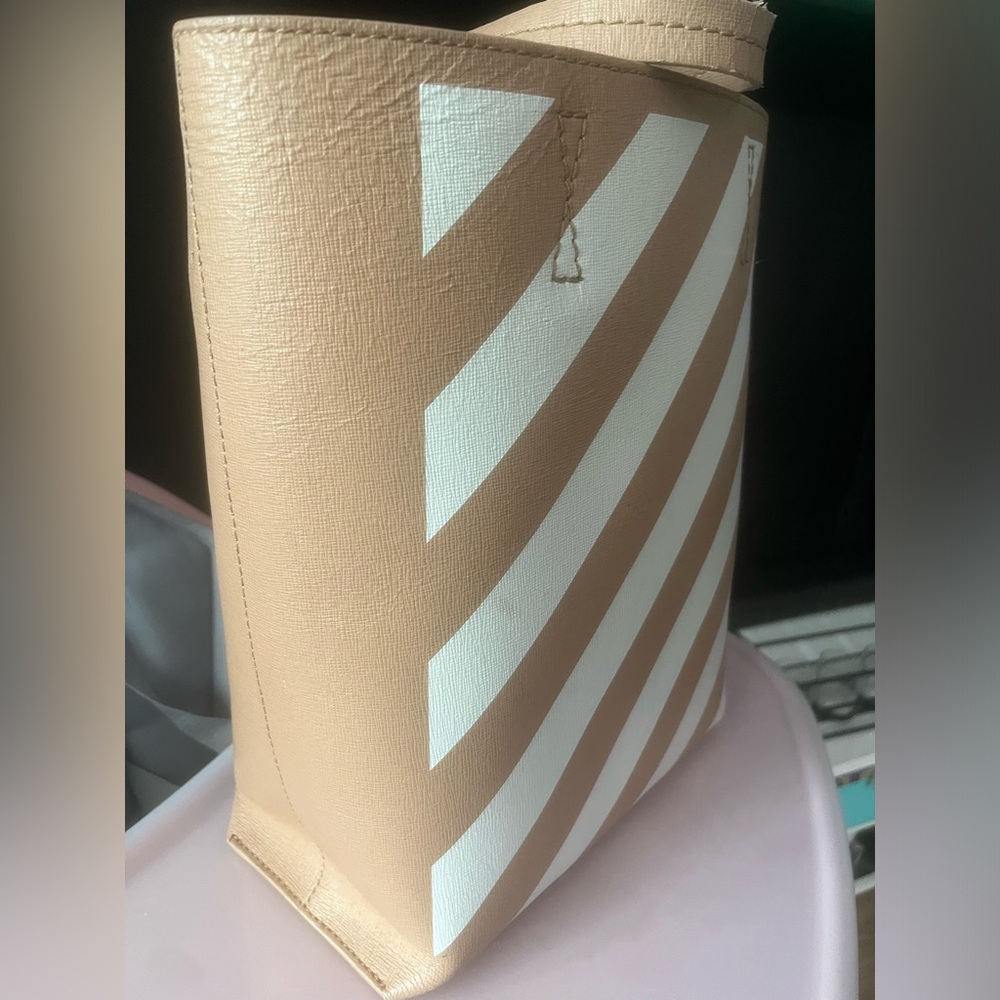 Tan and white bucket bag
